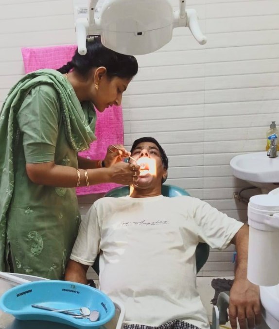 Routine dental check-up in progress at the clinic